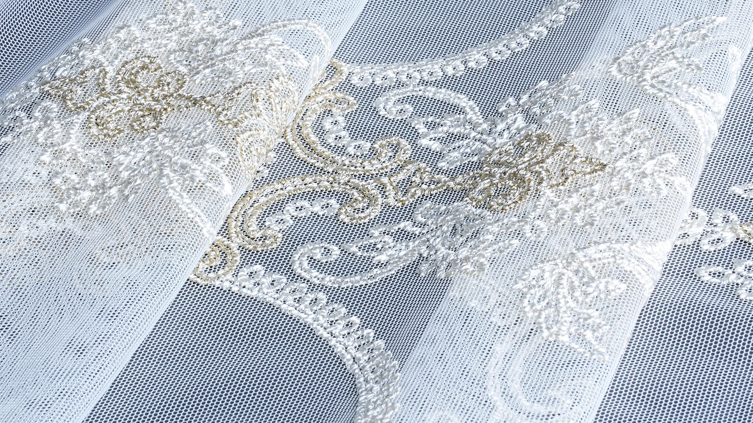 Sheer fabric on the loom showing PPI and EPI counts
