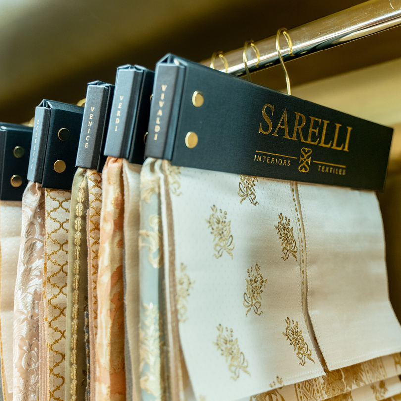 Sarelli fabric hangers on a showroom rail