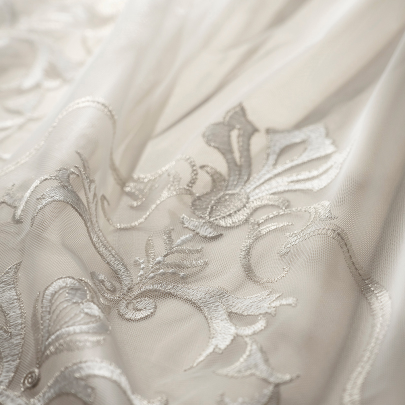 Sheer curtain with silver tone-on-tone embroidery